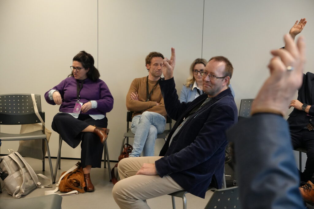Participants discussing using the fishbowl method, where one group sits in an inner circle to converse, while the rest of the participants observe from an outer ring. The discussions focused on The role of dialogue with working life, The Skills4Retail approach, From Research to Production: Rapid Rollout of Policy-Compliant Mcs and Designing Micro-Credentials for Soft Skills: Scalable, Learner-Centric Frameworks for Employability and Lifelong Learning
