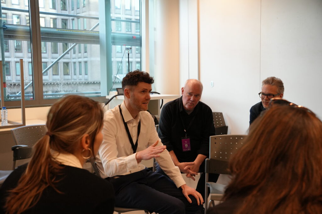 Participants discussing using the fishbowl method, where one group sits in an inner circle to converse, while the rest of the participants observe from an outer ring. The discussions focused on The role of dialogue with working life, The Skills4Retail approach, From Research to Production: Rapid Rollout of Policy-Compliant Mcs and Designing Micro-Credentials for Soft Skills: Scalable, Learner-Centric Frameworks for Employability and Lifelong Learning